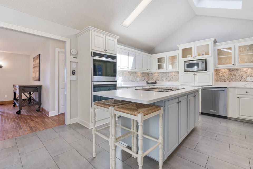 Kitchen includes double oven and double dishwashers.