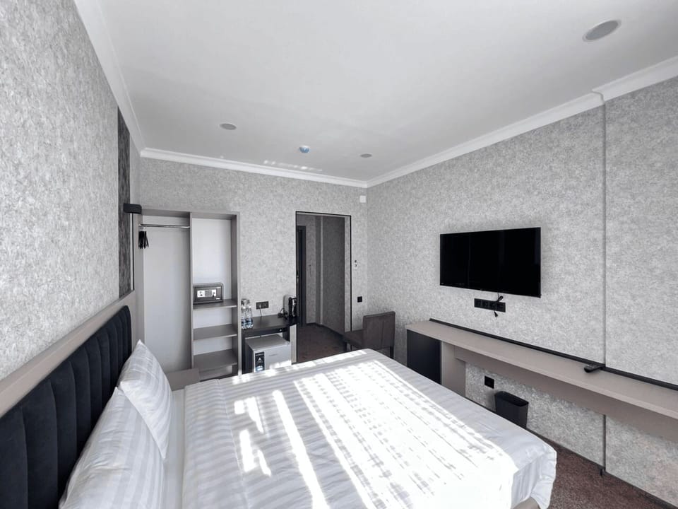 Standard Single Room, City View | In-room safe, desk, laptop workspace, blackout drapes