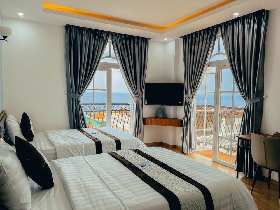 Deluxe Studio, Balcony, Beach View | In-room safe, desk, laptop workspace, soundproofing