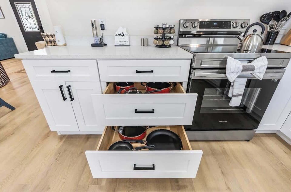 Pots and pans in all sizes, making cooking a breeze during your stay. #FullyEquippedKitchen #CookingMadeEasy