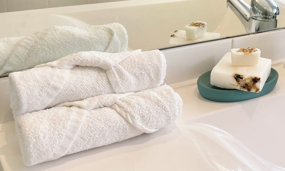 Lovely folded hand towels & hand made natural soaps for your hair+body.