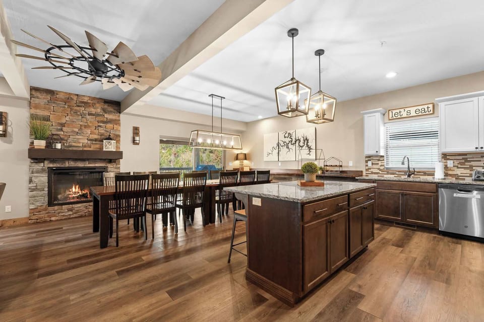 Walk right into this spacious living area with a stone fireplace on the back wall!