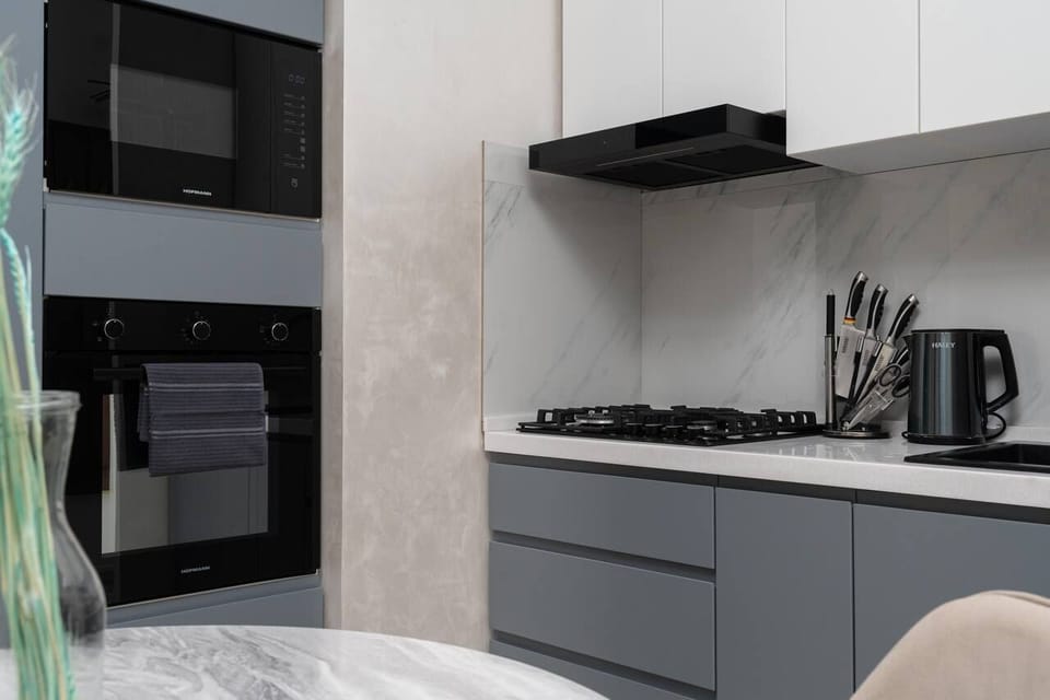 Family Condo, Balcony, City View | Private kitchen | Electric kettle