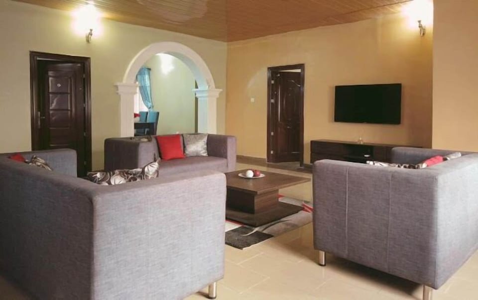 Economy Apartment, Balcony, City View | Living area | Flat-screen TV