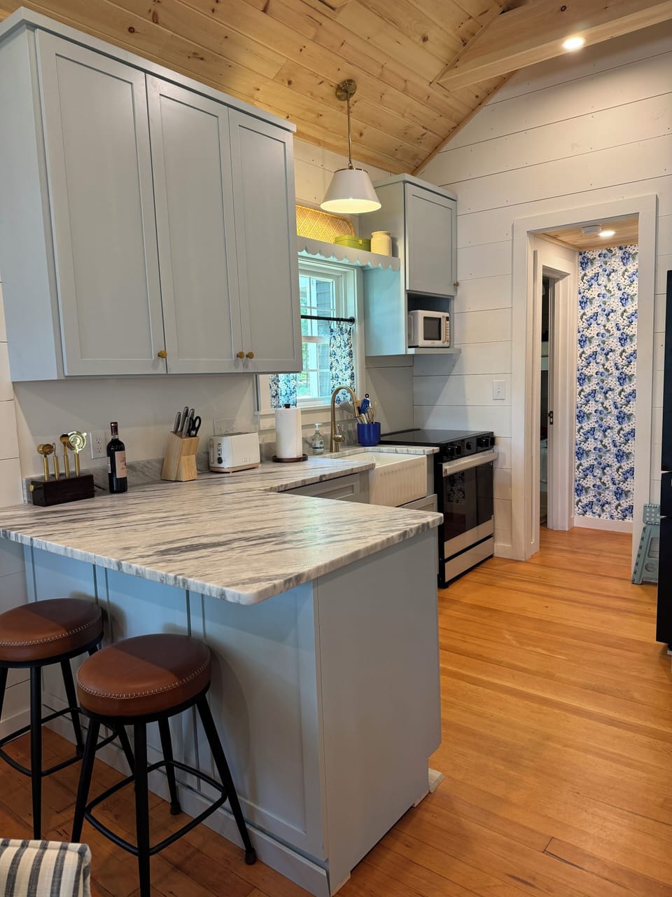 The bespoke kitchen contains full-sized appliances.