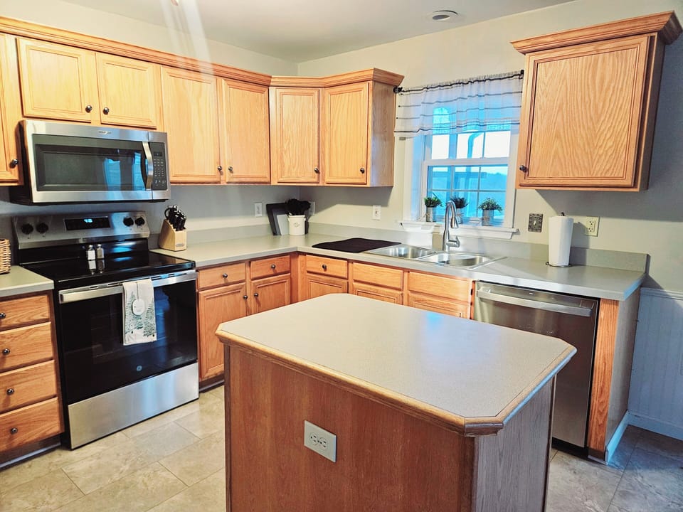 Kitchen with space for cooking  and family and friends to gather