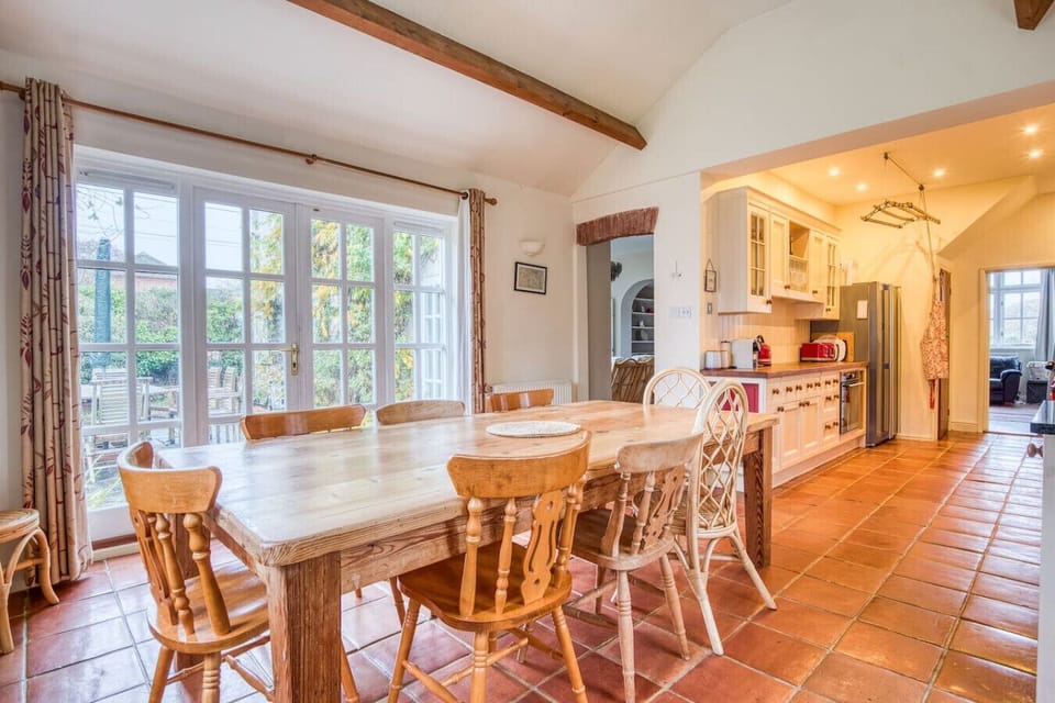 Large dinning room table overlooking the garden