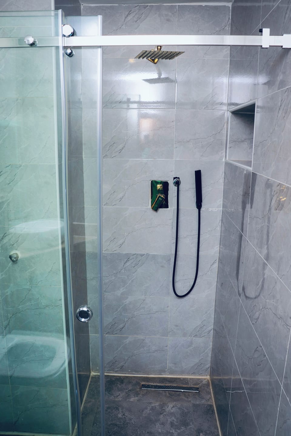 Shower, towels, soap, toilet paper