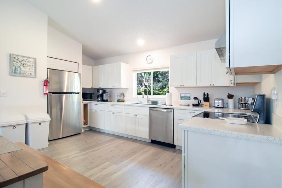 Full kitchen with fridge, dishwasher, oven, microwave, coffee maker & tea kettle