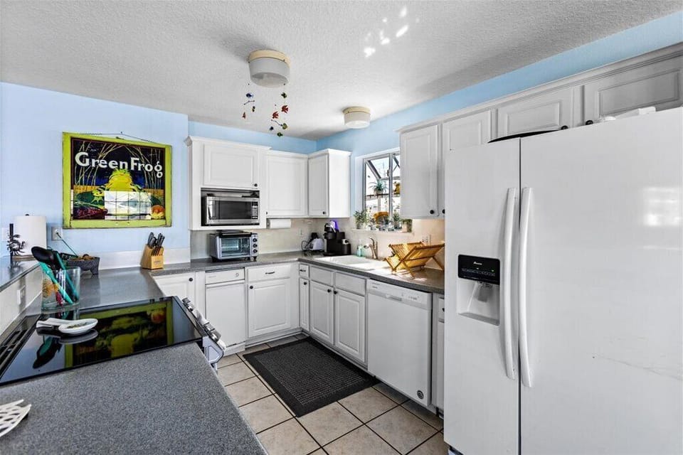 Large open kitchen with lots of storage and counter space.