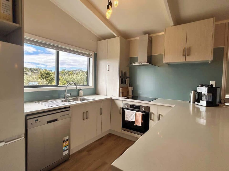Full Kitchen with oven dishwasher, espresso machine and water filter