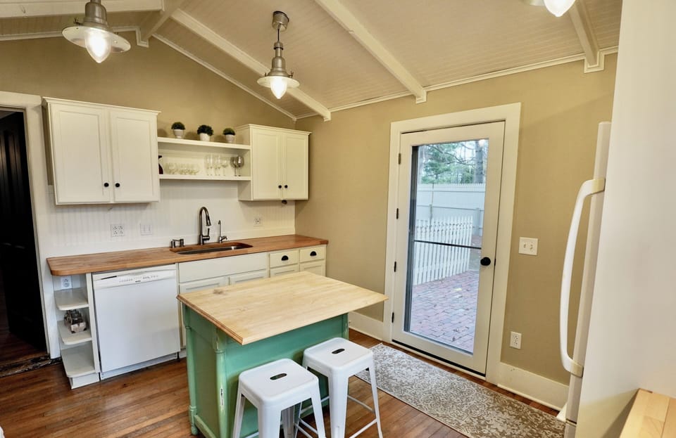 The Kitchen ~ Exterior door leading to the beautiful patio and fenced in yard. 