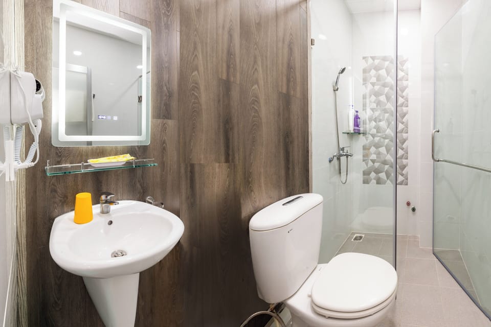 Shower, hair dryer, slippers, towels