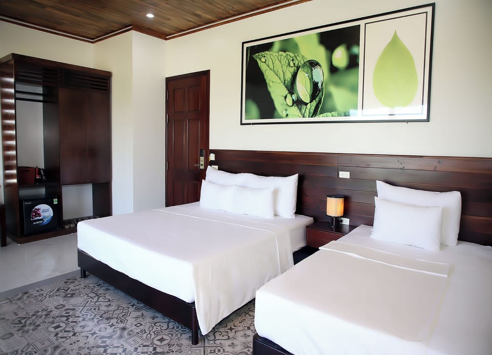 Deluxe Triple Room | Minibar, desk, laptop workspace, soundproofing