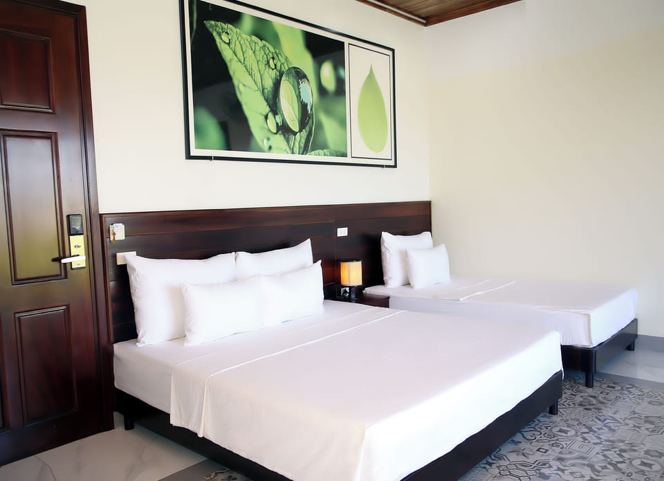 Deluxe Triple Room | Minibar, desk, laptop workspace, soundproofing