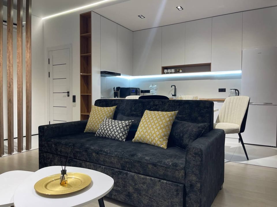 Family Studio Suite, Balcony, City View | Living area | 43-inch flat-screen TV with digital channels, TV