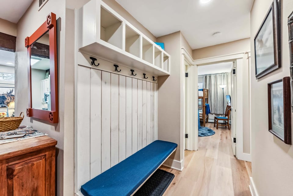 Entryway: Bench, coat hooks, storage cubbies, shoe rack
