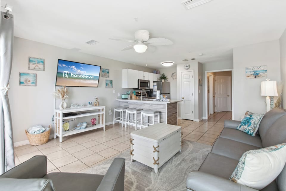 Signature Condo, 1 Bedroom, Balcony, Pool View | Living room | 55-inch Smart TV with cable channels