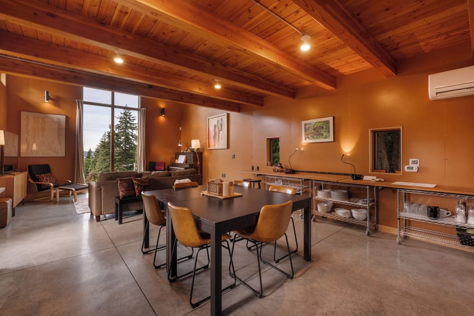 In addition to the six seats at the square table, there are two counter stools along the window counter.