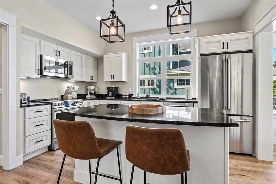 Modern kitchen with stainless steel appliances.