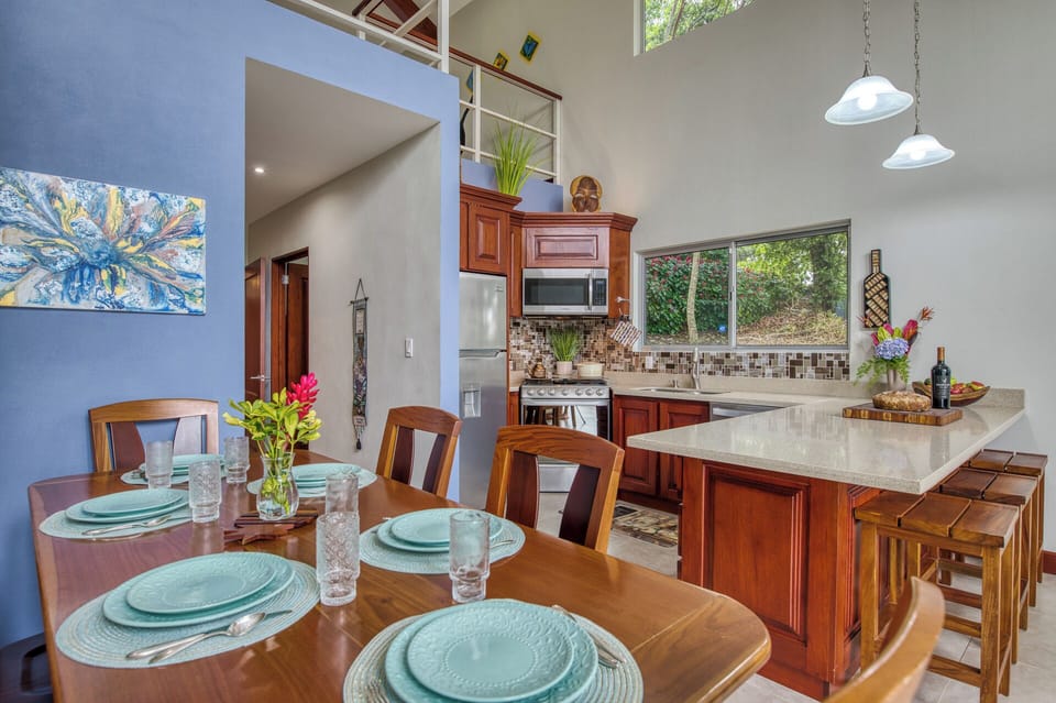 Dining and Kitchen area with lovely peninsula and large surface for preparing fresh foods found locally.