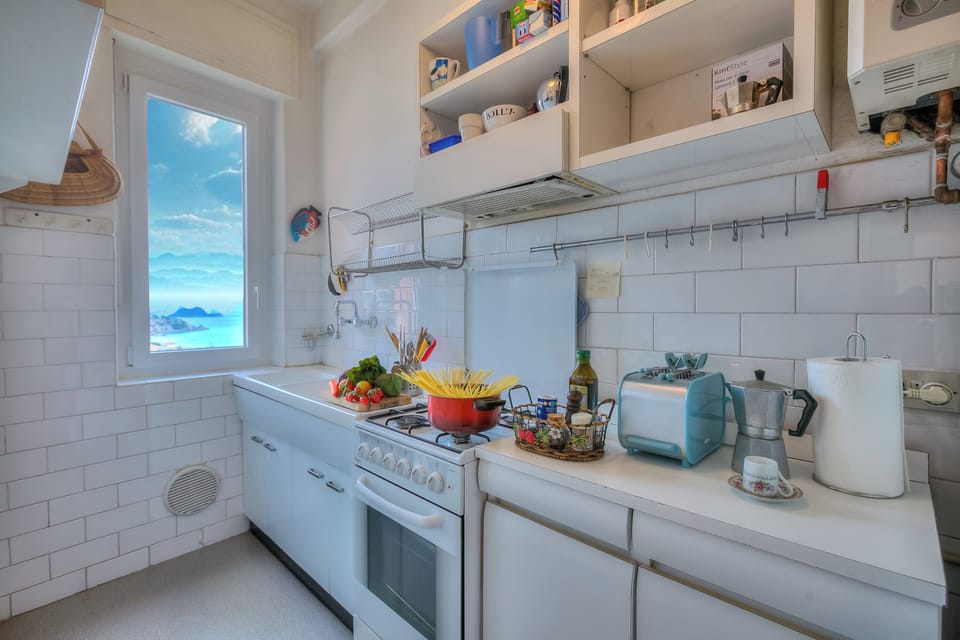 Standard Apartment, Multiple Bedrooms (Simply Romantic Sea View) | Private kitchen | Fridge, oven, stovetop, coffee/tea maker