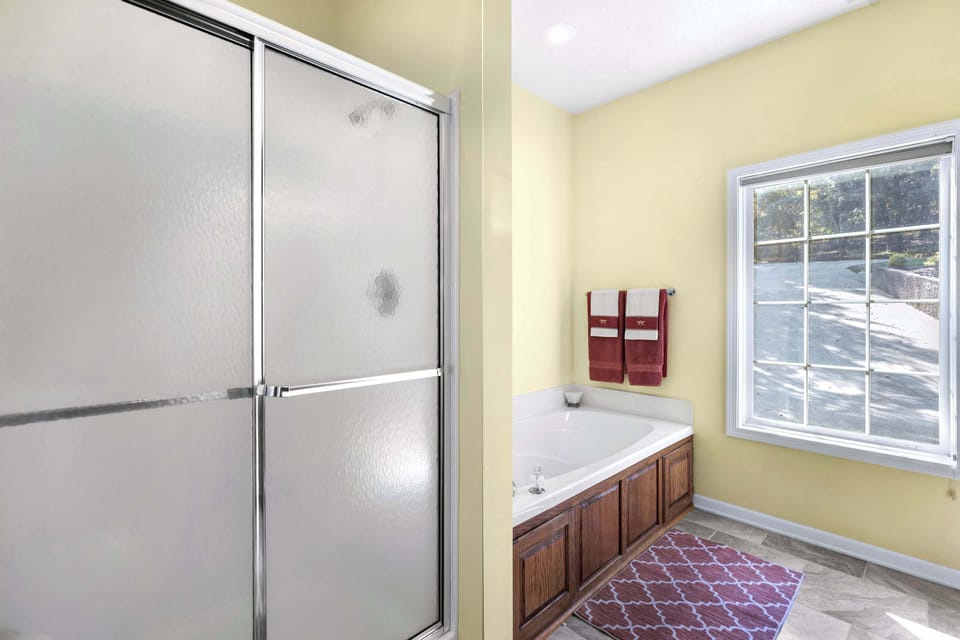 Ensuite bathroom with separate shower, and tub