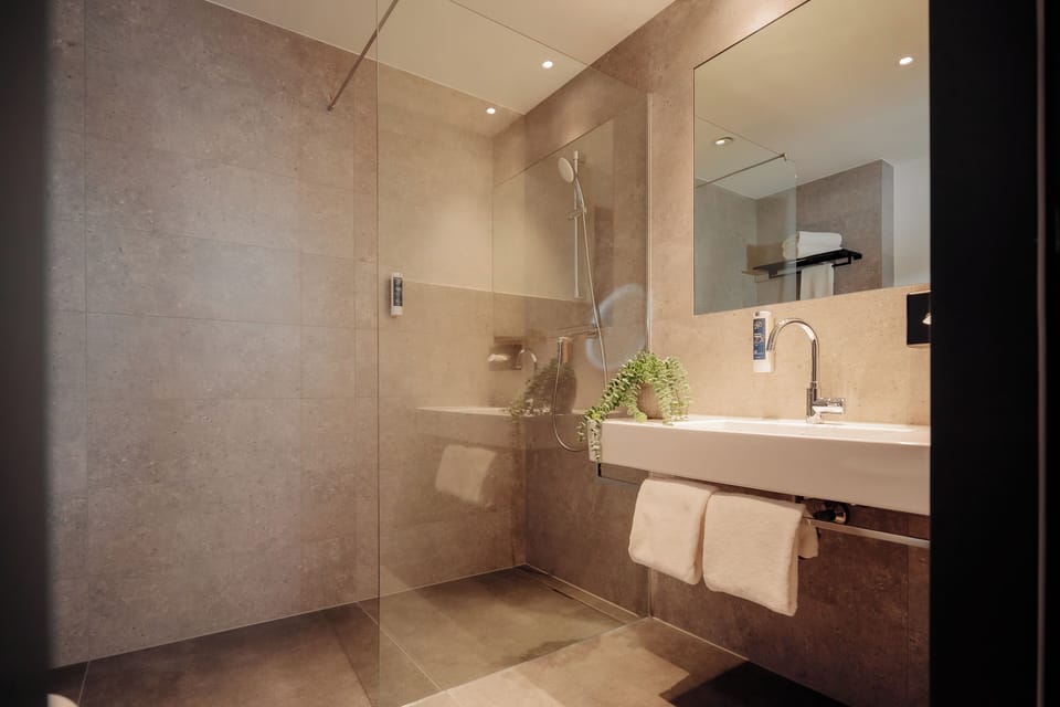 Shower, hair dryer, slippers, towels