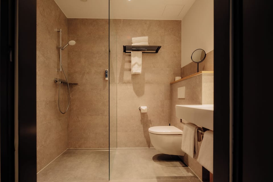 Shower, hair dryer, slippers, towels