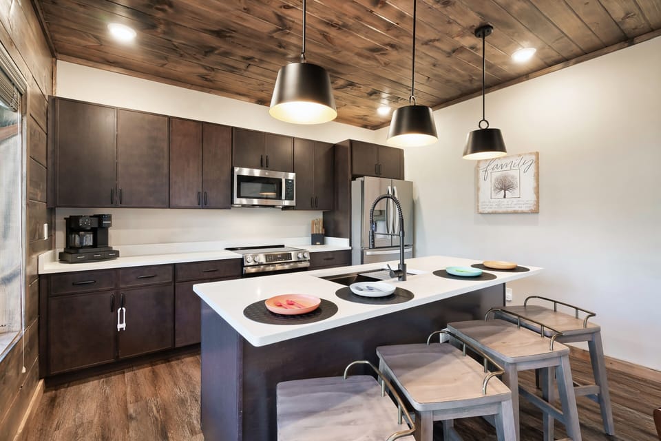 Fully stocked kitchen with family-friendly dishware and modern appliances