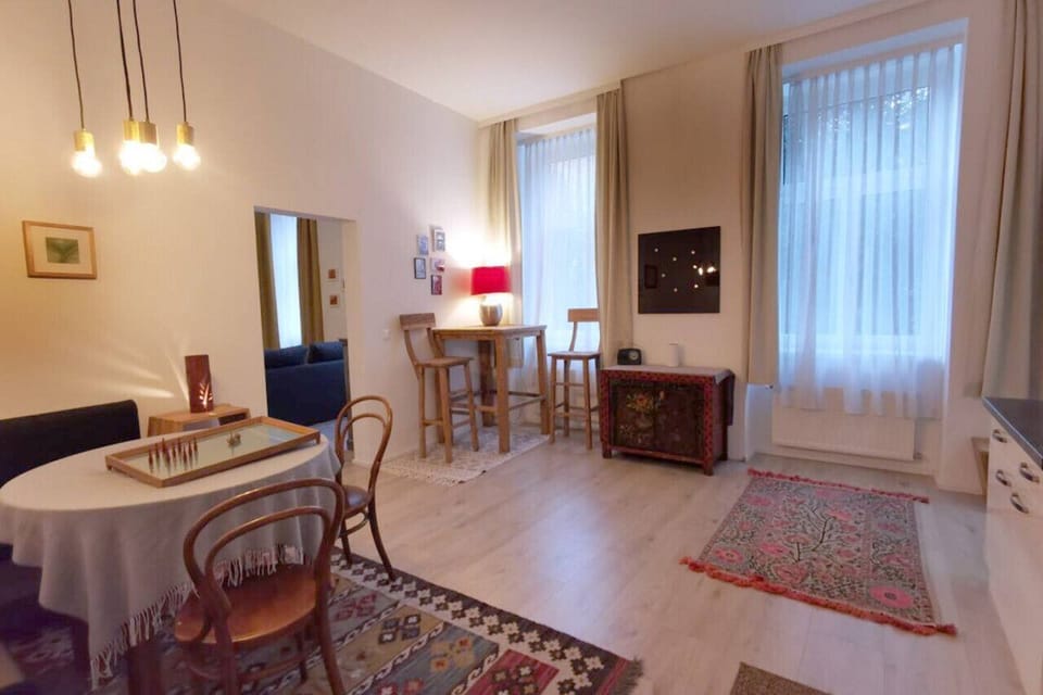 Apartment, Courtyard View | Living area | 140-cm flat-screen TV with digital channels, offices