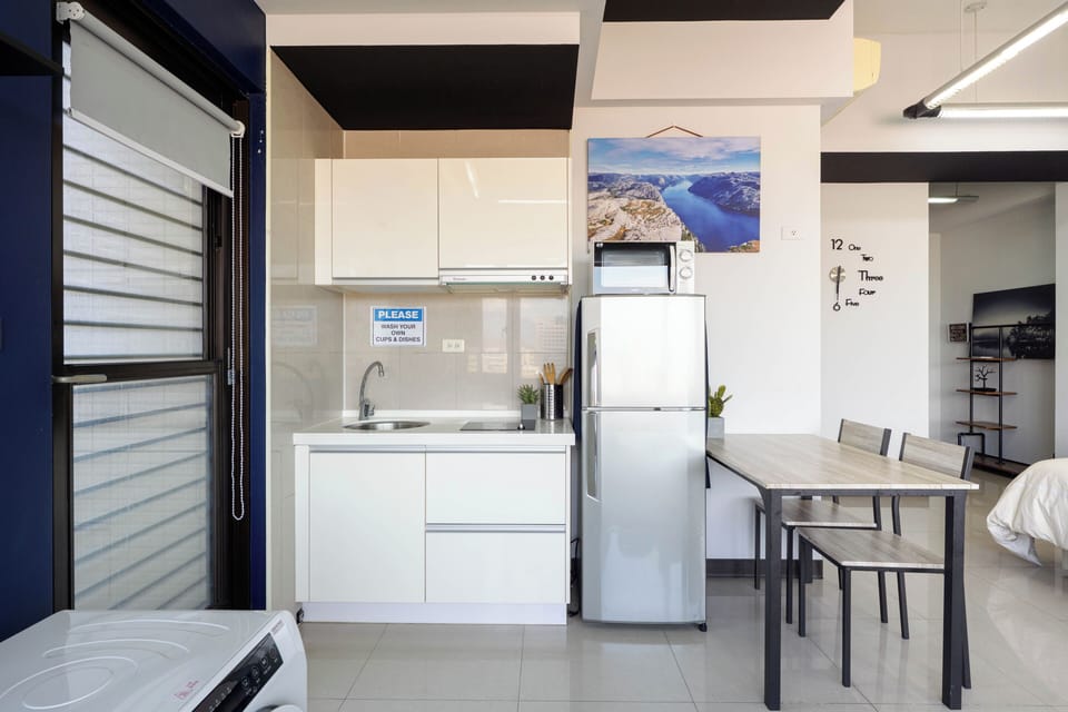 perfect kitchenette with electric stove, fridge, and microwave
