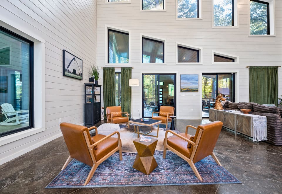 Settle into one of the cozy chairs with a good book or simply enjoy the peaceful views that fill this beautiful living area.