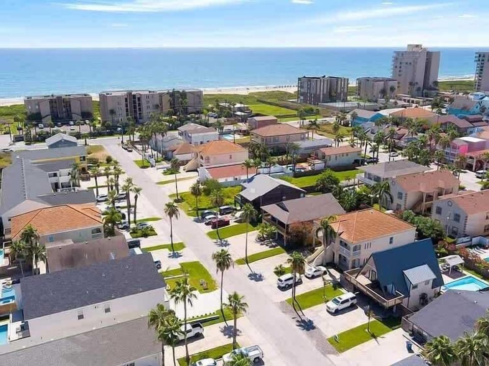 This property is on the LEFT side of this picture with orange room. You can see it is less than 1/2 a block to the beach