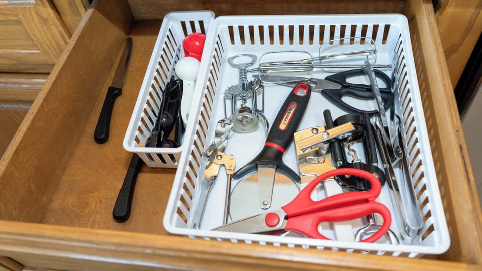 Fully Stocked Utensil Drawer
Oak drawer overflows essentials: tongs, whisks, spatulas, peelers, shears, knives, & more in organizers. Bake, grill, chop w/ ease—everything you need for seaside meals in this ready-to-cook beach retreat!