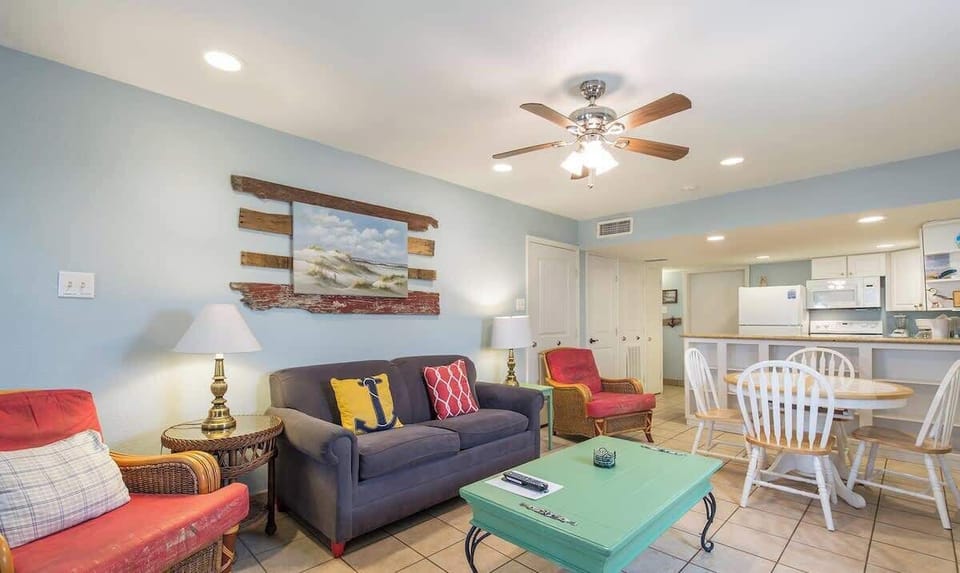 A bright, welcoming space where coastal colors and easygoing décor create a relaxed, lived‑in feel. The open layout brings a sense of warmth and simplicity, making it a comfortable spot to unwind, gather, and enjoy unhurried moments together.