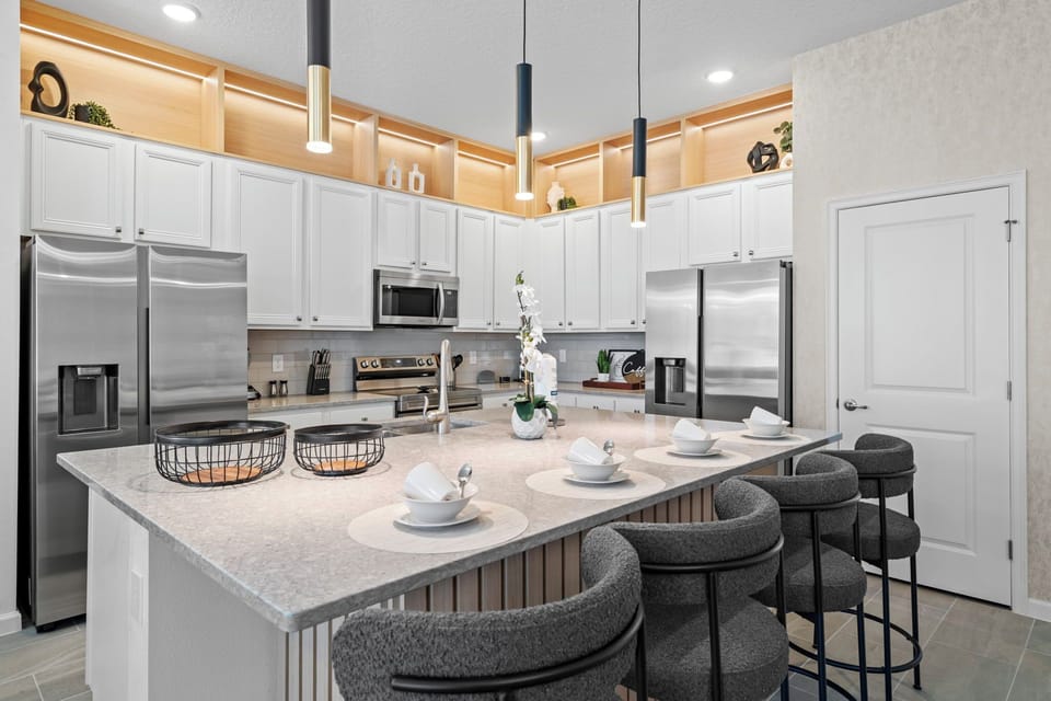 Large kitchen, fully equipped with stainless steel appliances.