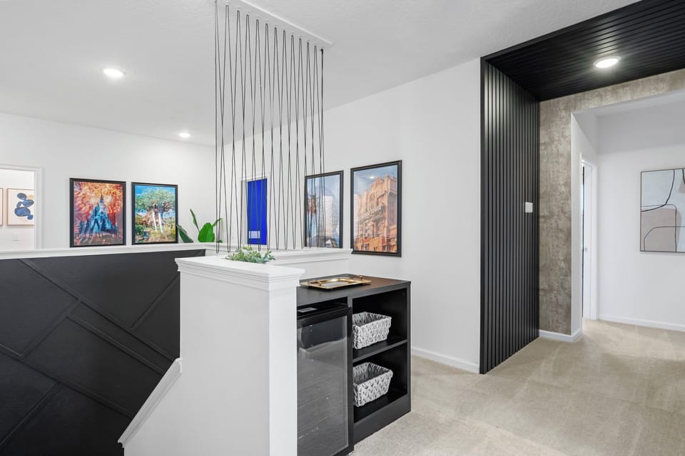 Space with minibar and access to bedrooms.
