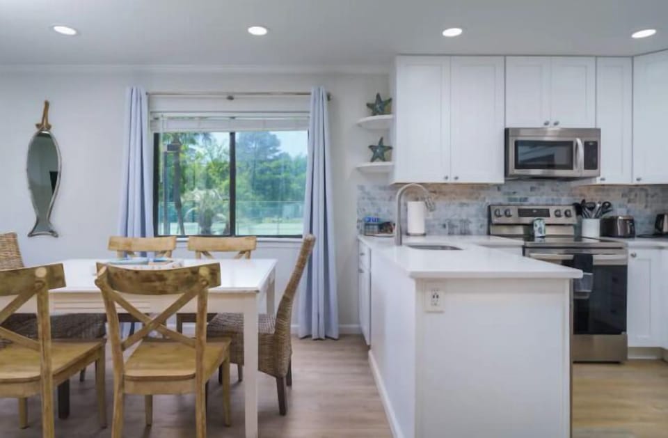 The dining area and kitchen are spacious with an open floor plan