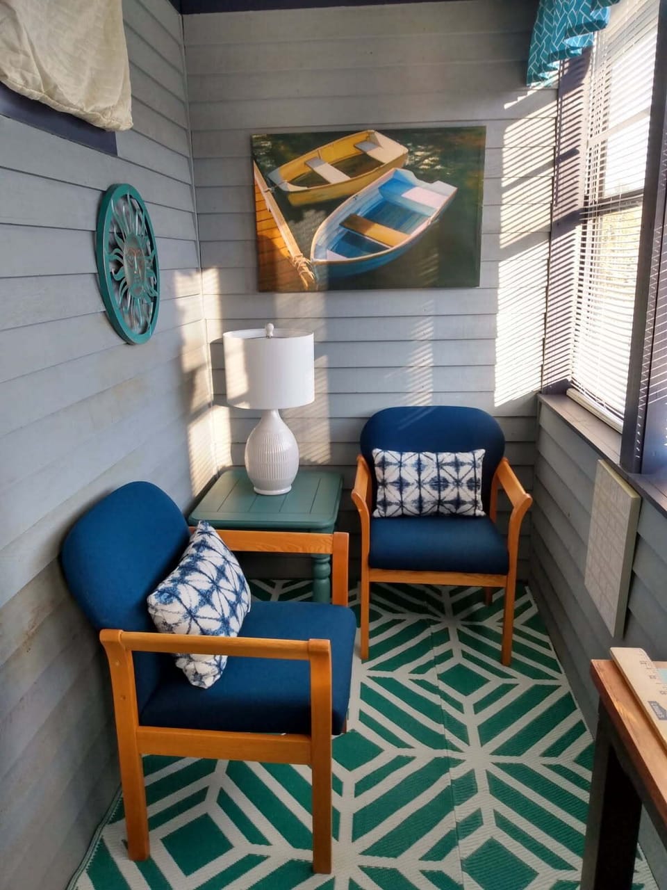 Enclosed porch overlooking the tennis courts 