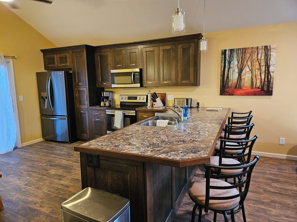 Create culinary masterpieces in full size kitchen. USB charger on counter.