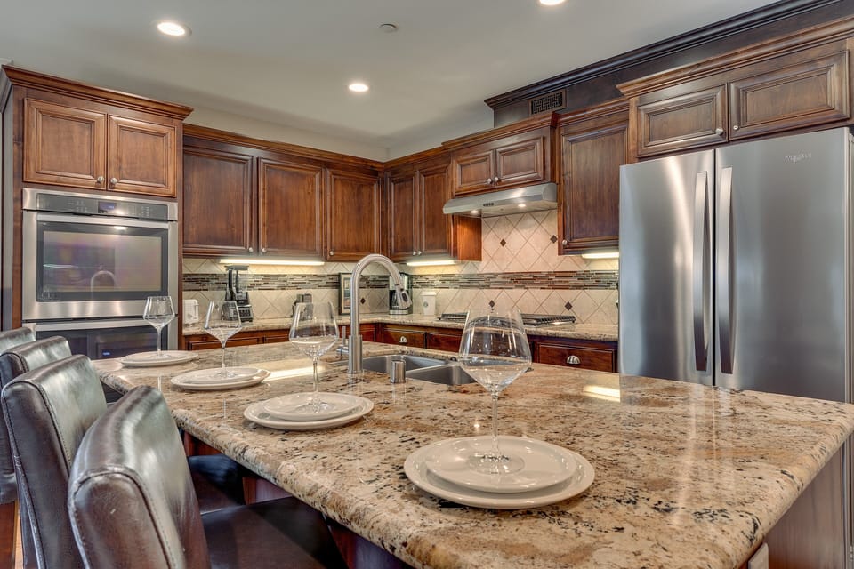 Kitchen area with stainless-steel appliances and large island