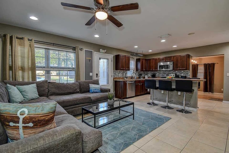 Open concept living room and kitchen, perfect for socializing and entertaining. #OpenConcept #ModernLiving #LargoRetreat