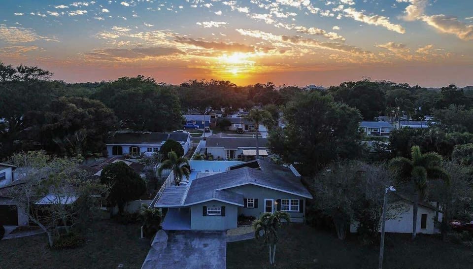 Aerial shot of our stunning home with the Gulf in the distance—your perfect Florida retreat. #GulfViews #AerialBeauty #LargoOasis