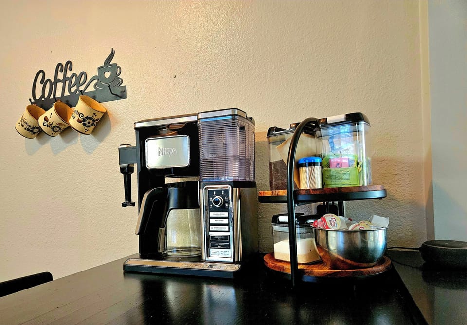 stocked coffee bar with Ninja coffee maker.
