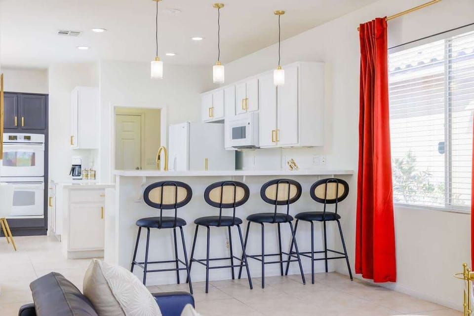 Bright kitchen with red accents and plenty of counter space