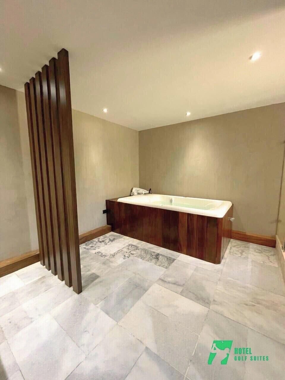 Luxury Suite, Golf View | Bathroom | Combined shower/tub, hair dryer, slippers, towels