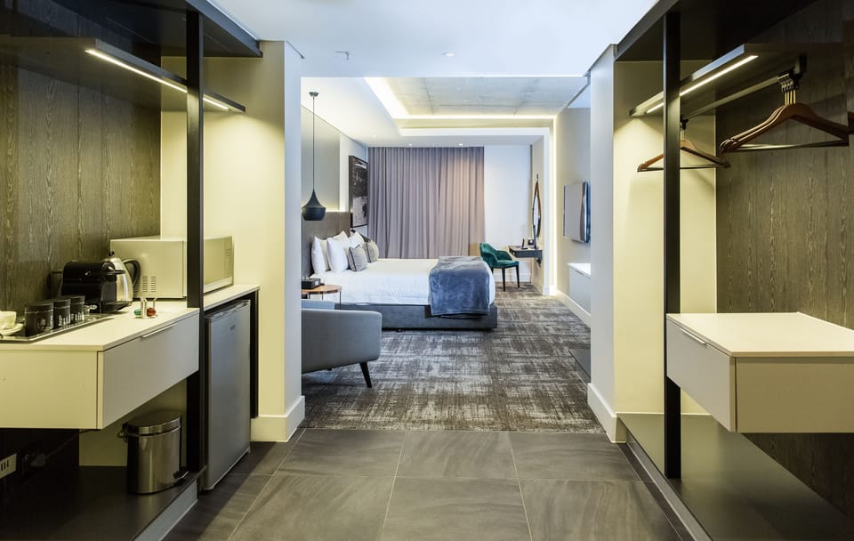 Luxury Suite, 1 King Bed, Ensuite | In-room safe, desk, laptop workspace, soundproofing