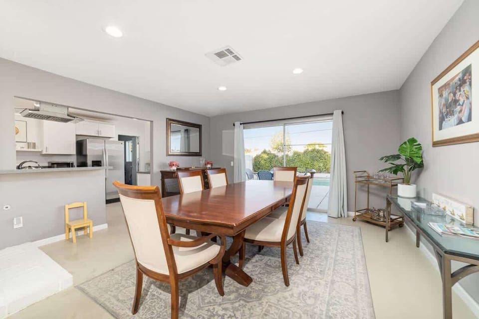 Open dining area with seating for six and bright views