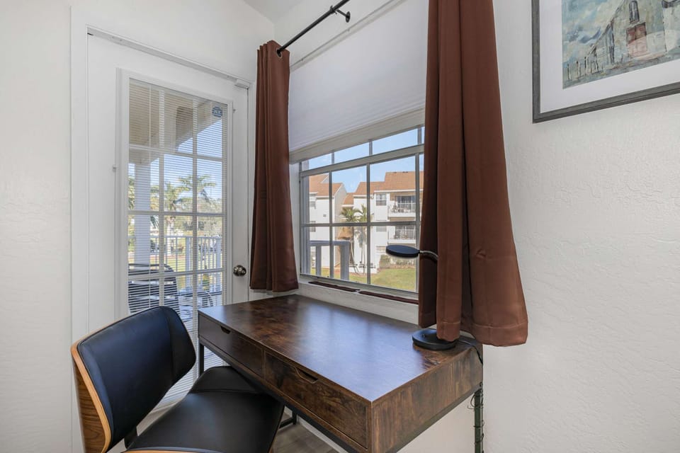 Workspace overlooking pond and by patio entrance